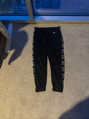 Nike Black Jogger Pants with White Logo Tape